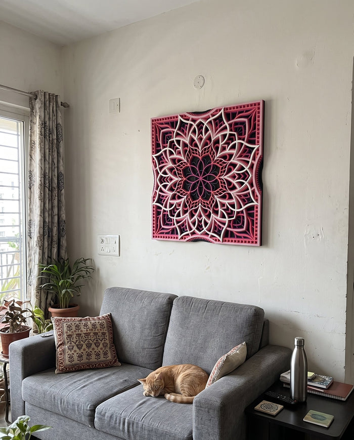 Layered mandala above a sofa with a cat